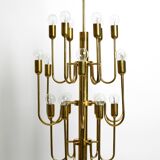 Three staged 18 arm Mid Century brass chandelier with a long brass rod