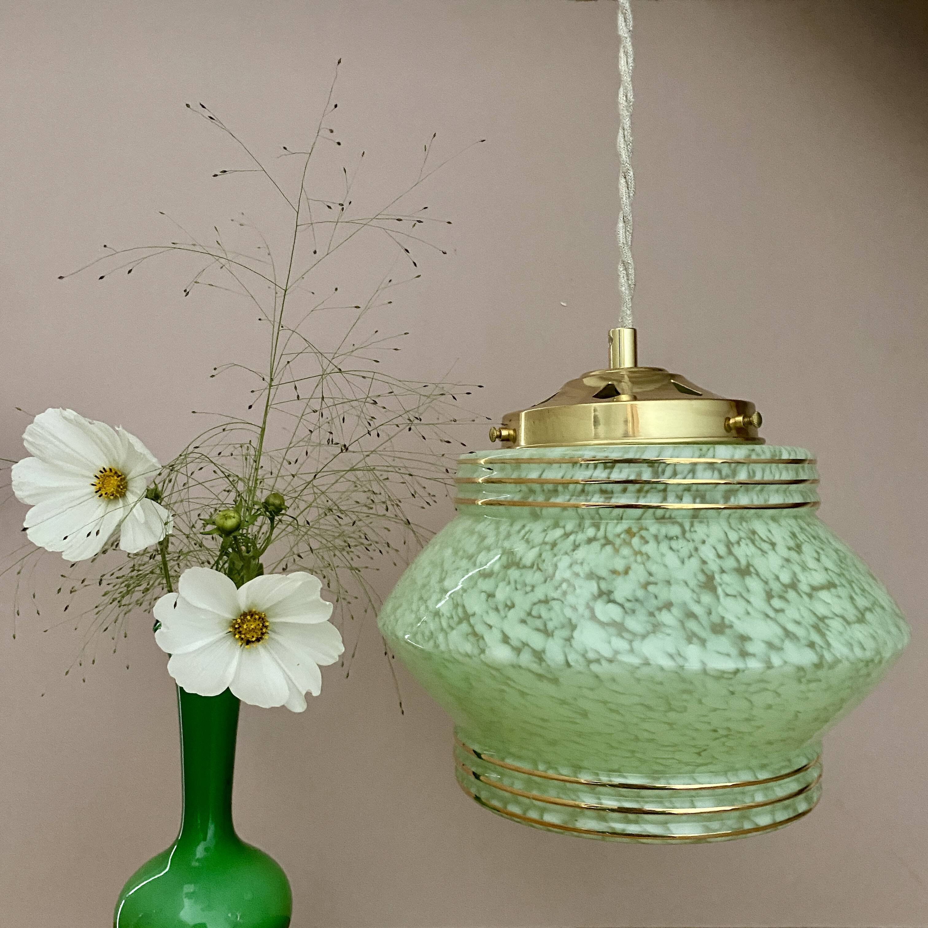 Art Deco globe pendant light in mint green and gold Clichy glass
