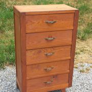 Vintage 1950s chest of drawers with tapered legs and 5 drawers.