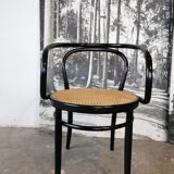 Curved wood and cane armchair called "Le Corbusier"
