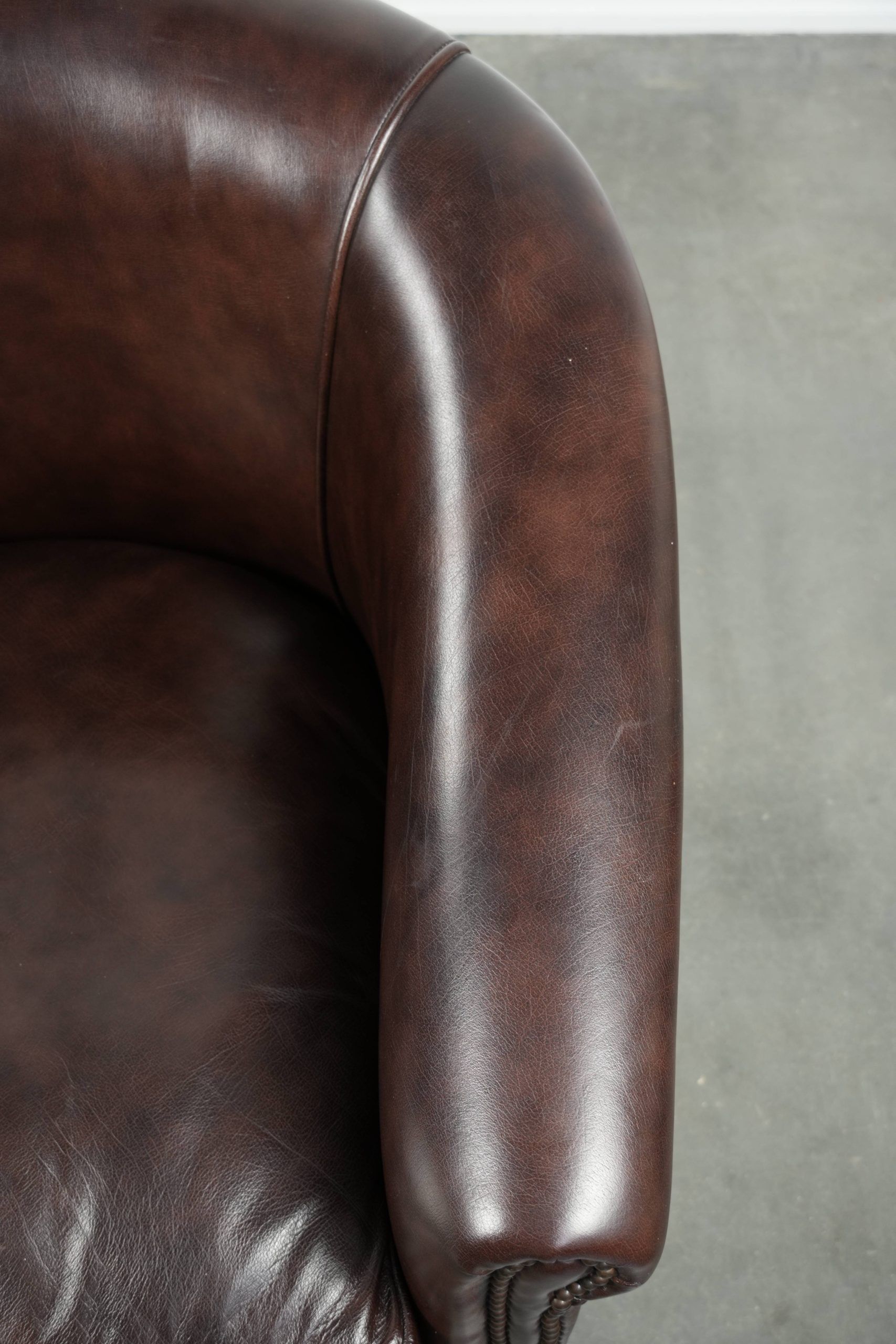 Set of two cowhide club armchairs in good condition with a English design