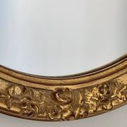 Oval mirror in carved wood