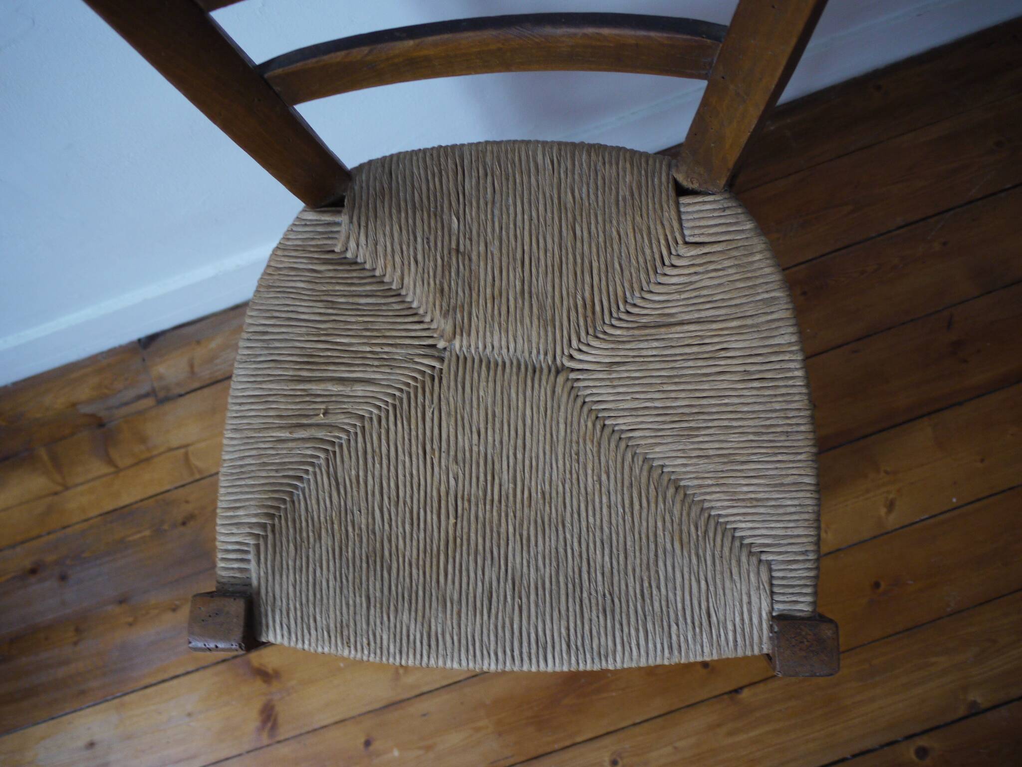 Wooden chair with straw seat
