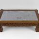 Solid oak coffee table carved with fauns and gray marble top, France, circa 1940
