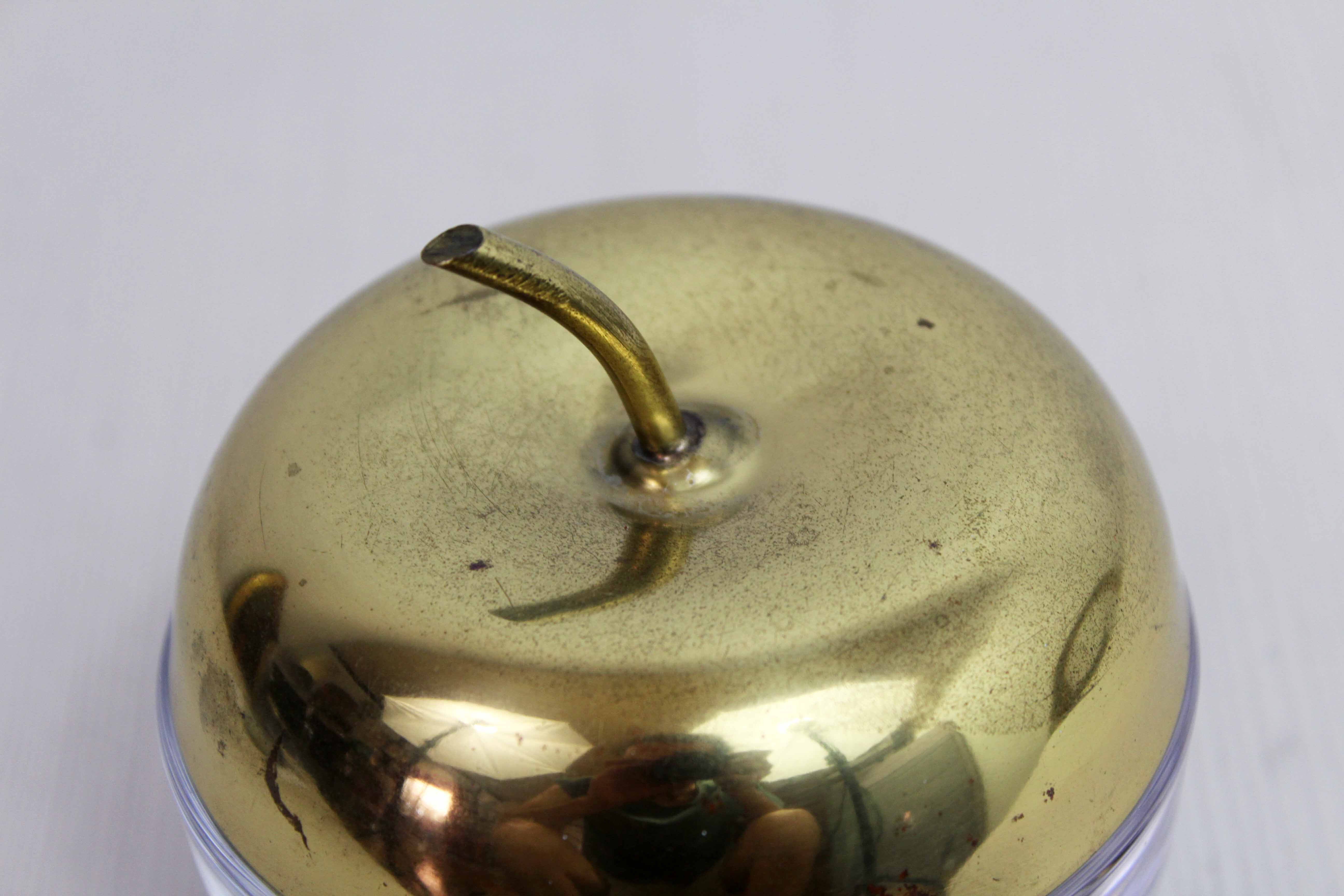 Glass and brass apple sweetener