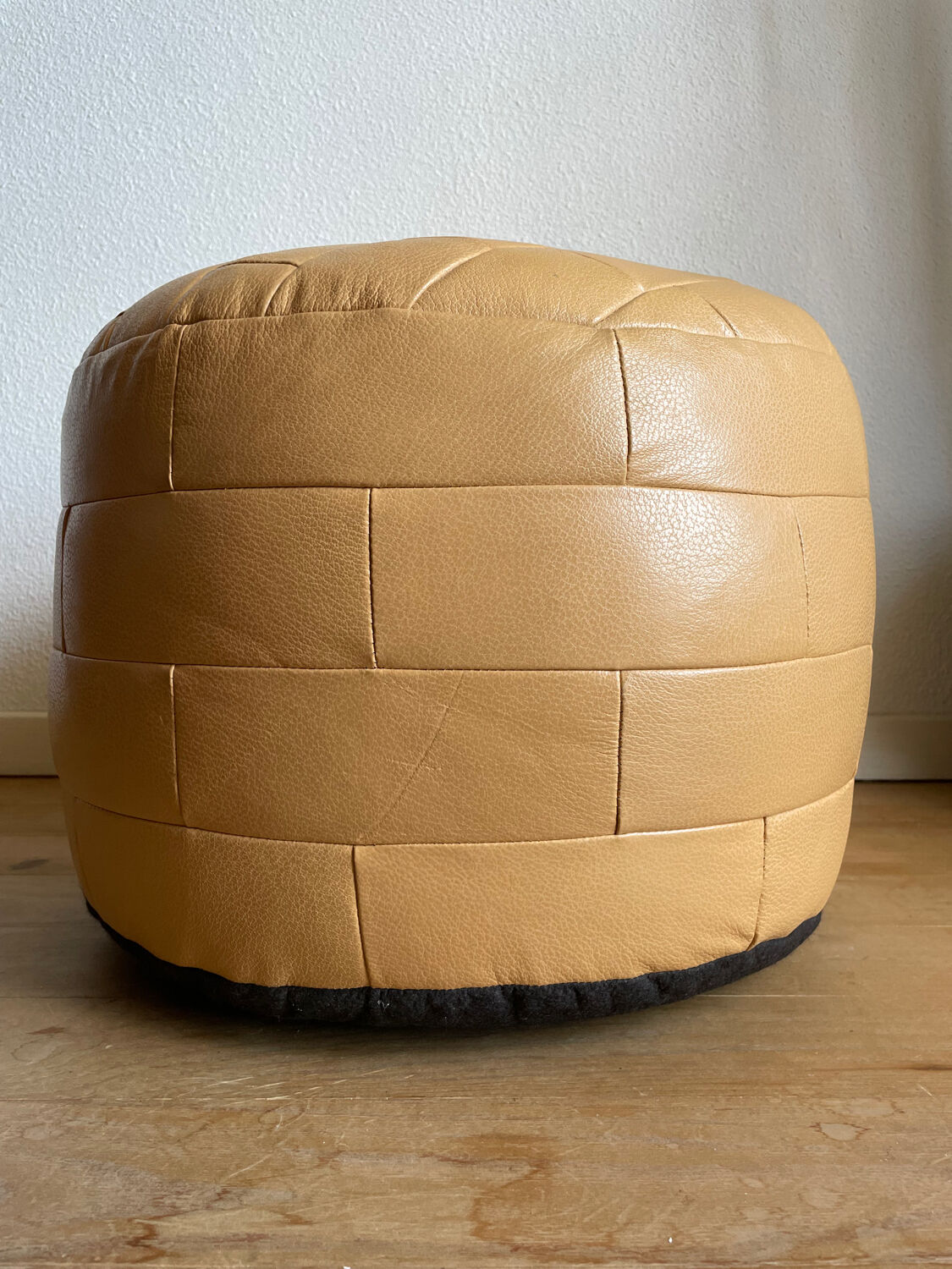 Beige patchwork leather pouf from Sède