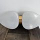 Pair of vintage wall lights from the 60s-70s in striped opaline glass and gilded brass.