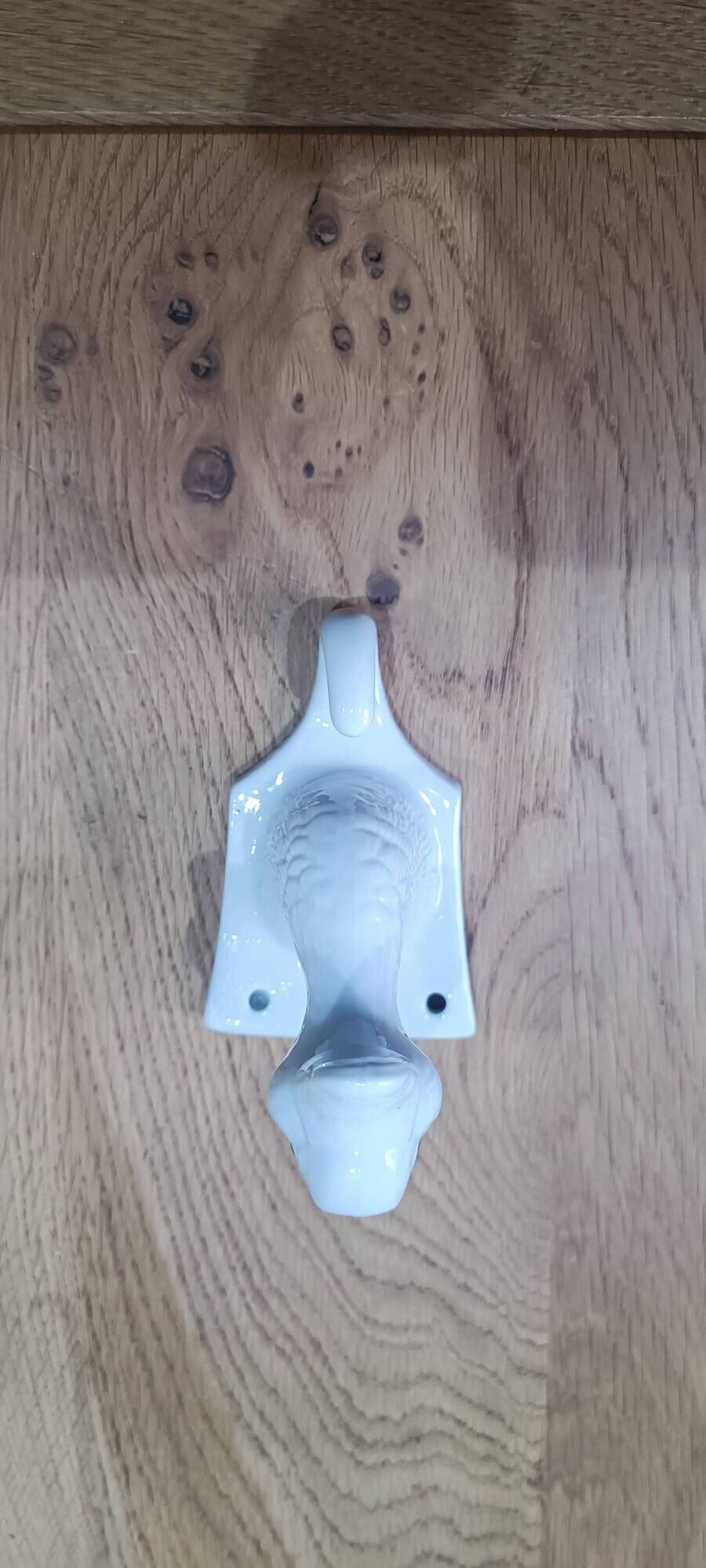 Wall-mounted duck head coat hook in white ceramic, cottagecore style.