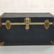 Old black trunk and brass