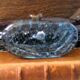 Murano glass gondola placed on a blue water-effect glass base