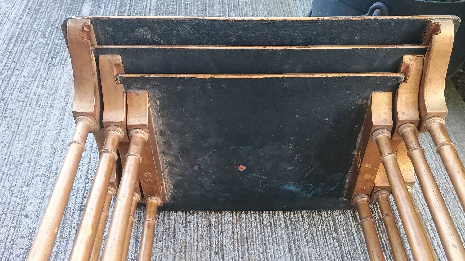 Sets of three nesting tables with painted landscape decorations in poplar.