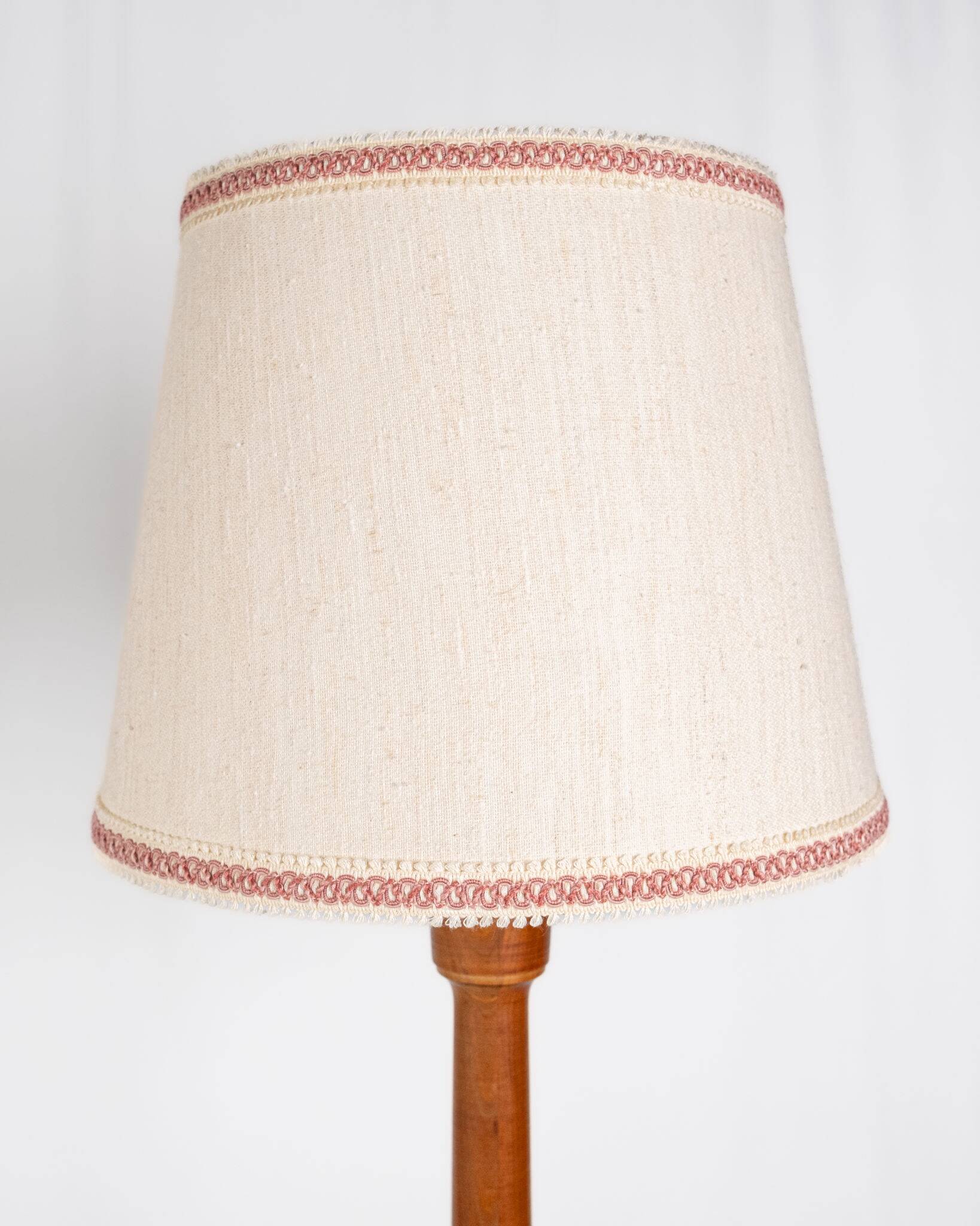 Pair of turned wooden floor lamps in Art Deco style, France, mid-20th century.