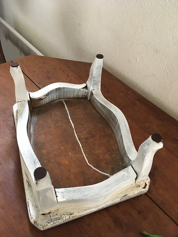 Former foot, skated in white wooden rest