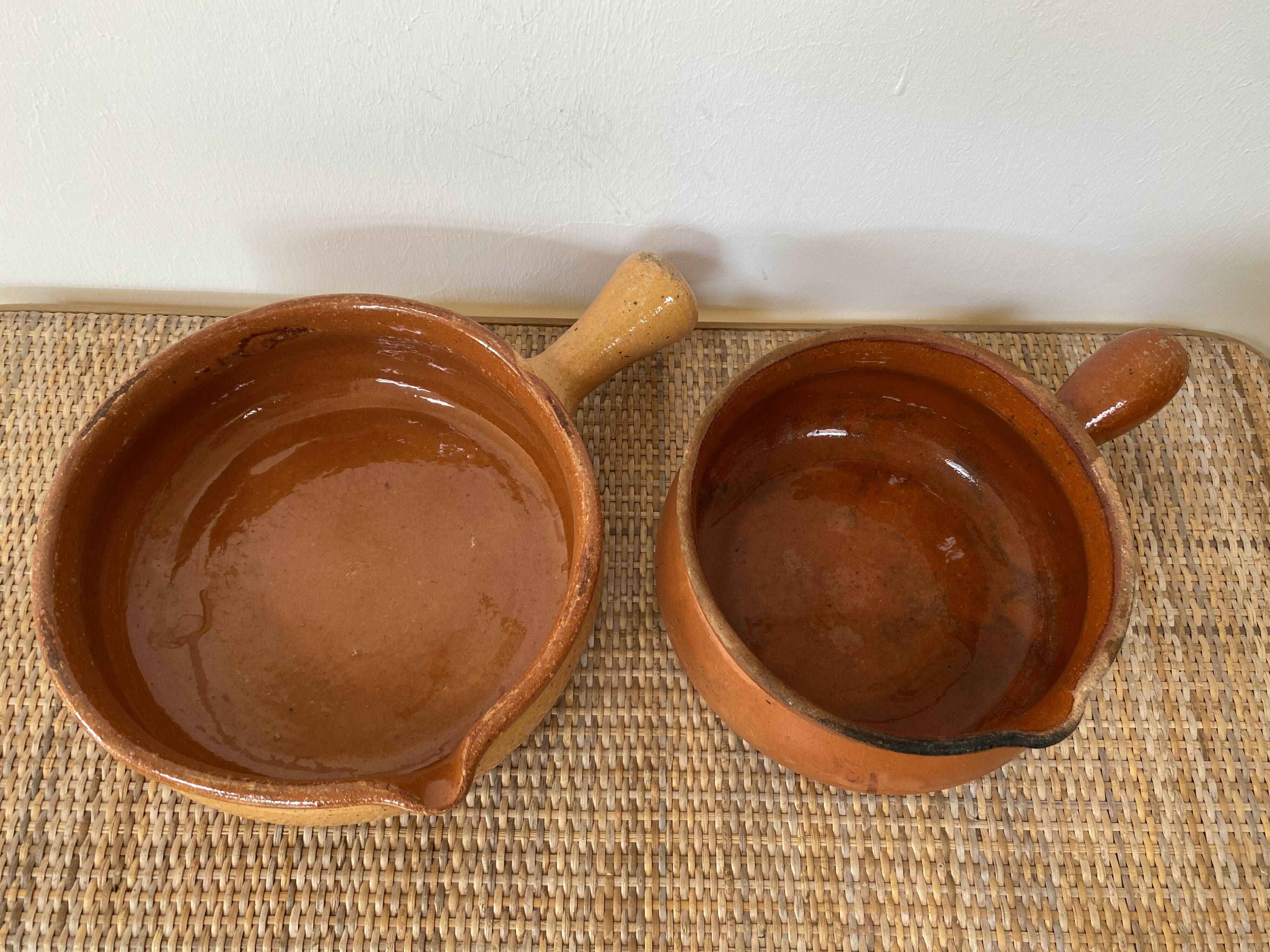 Pair of old pocket pots in glazed stoneware