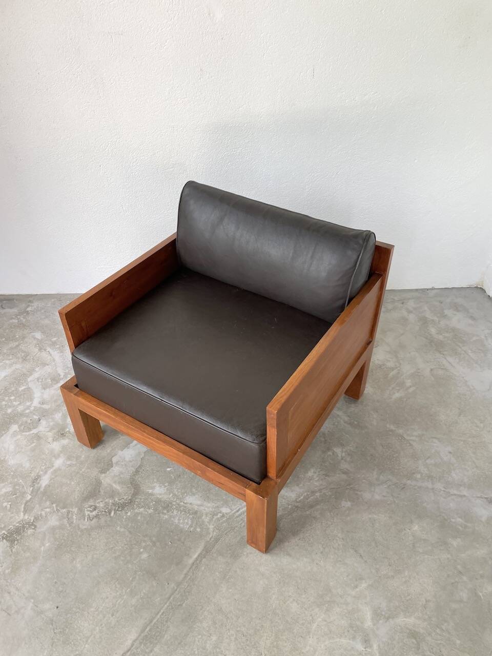 Modernist armchair in exotic wood and leather