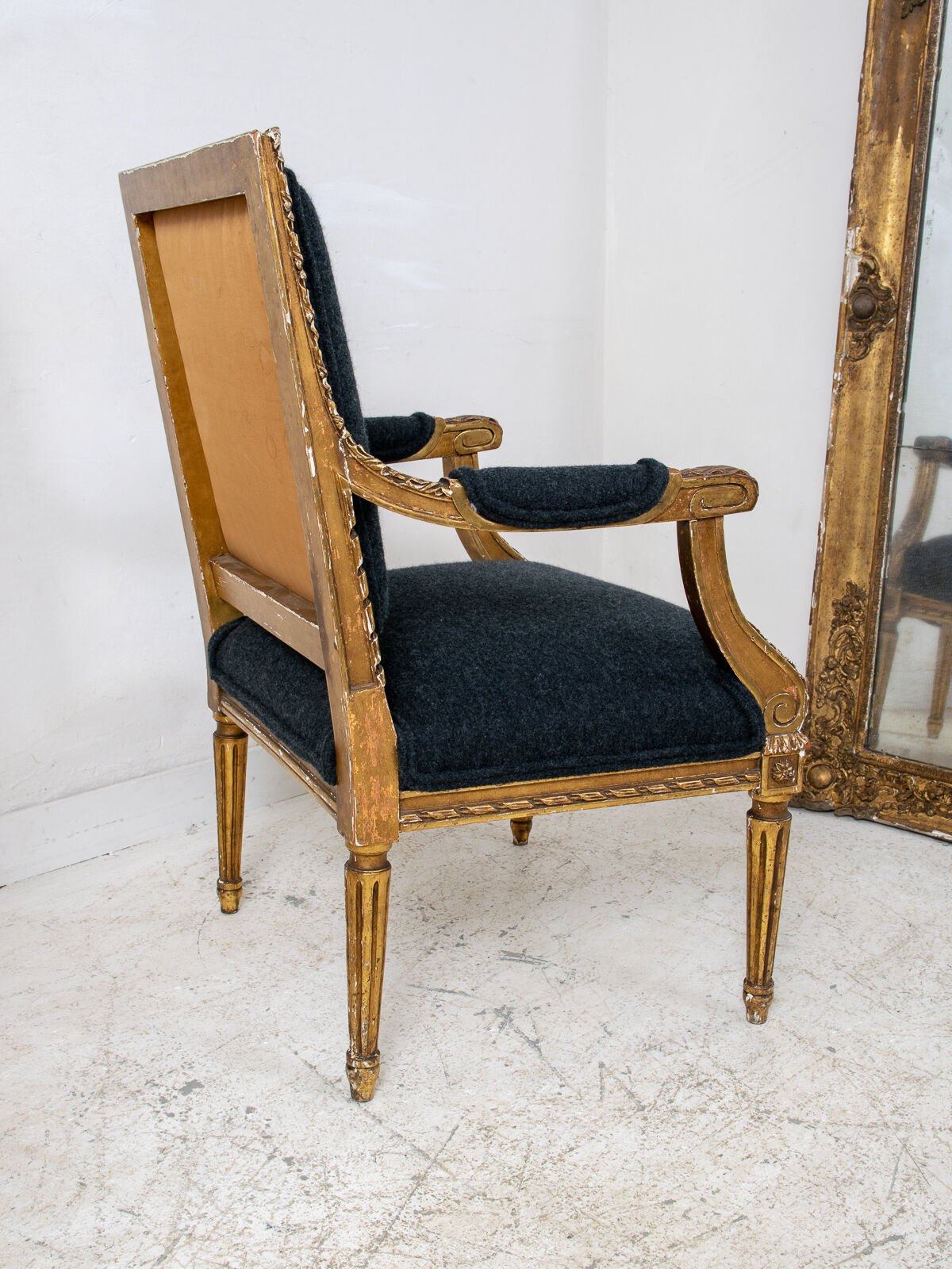 Pair of 19th century Louis XVI gilt armchairs newly re upholstered in holland and sherry fabric