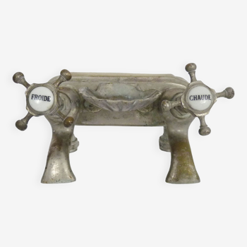 Old bathtub faucet, kitchen in silvered bronze with its shell-shaped soap dish