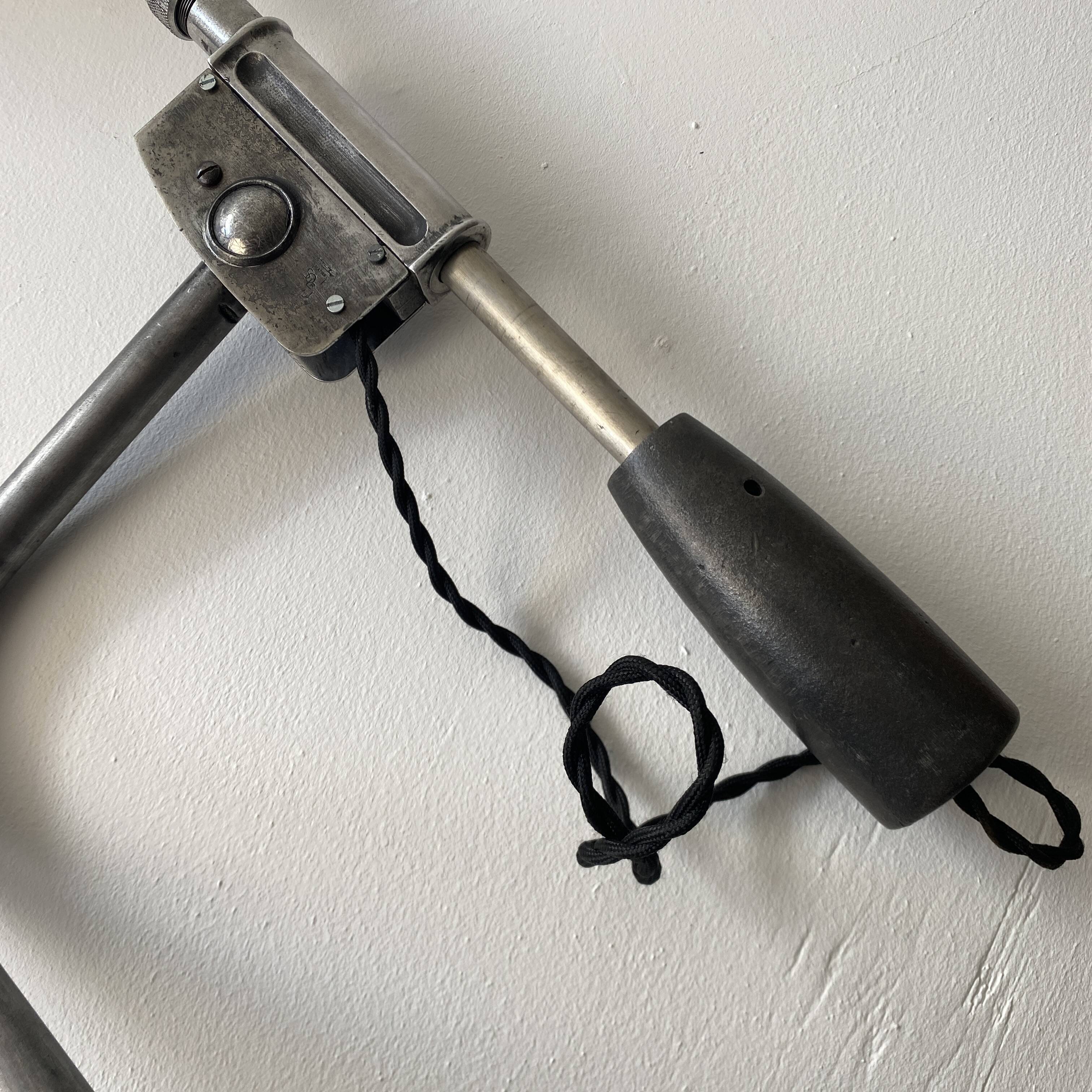 Old industrial wall light with counterweight.