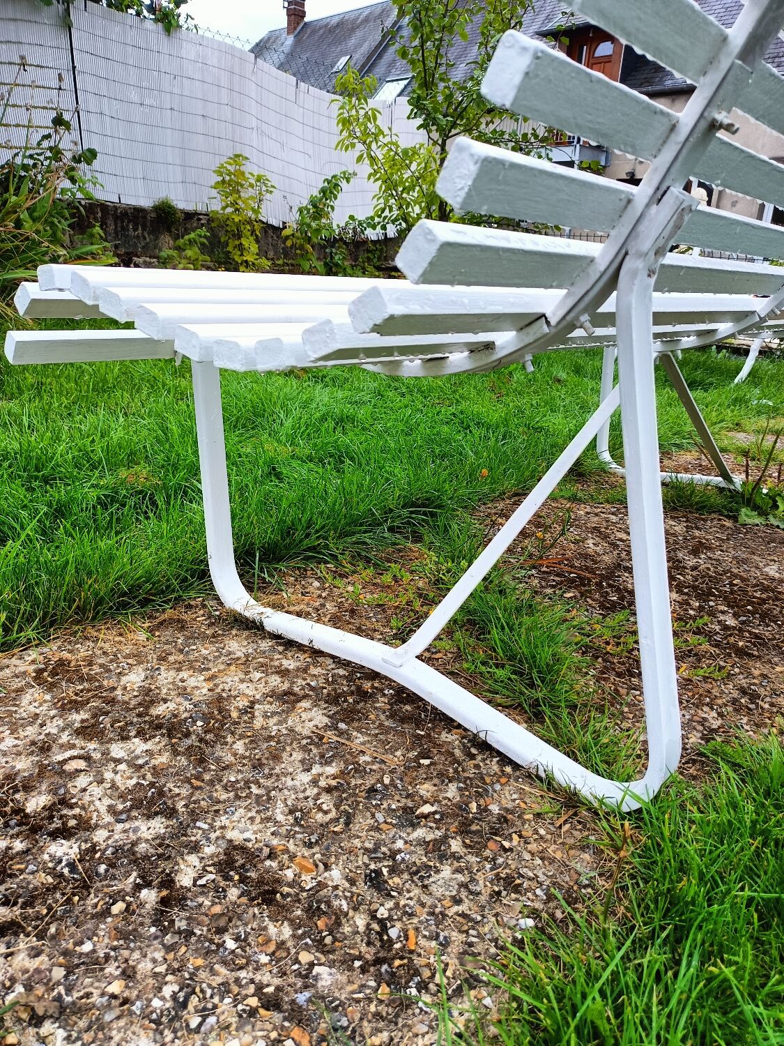 Antique garden bench with metal legs