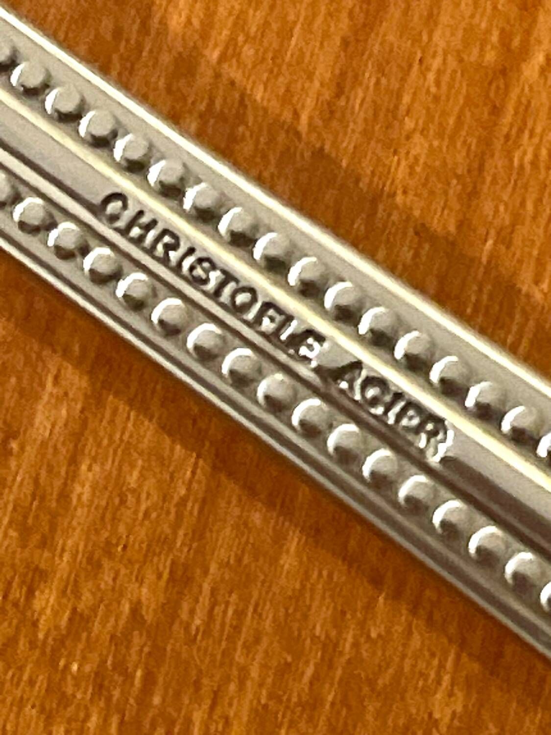Christofle perles acier ,ménagère 38 pièces état neuf