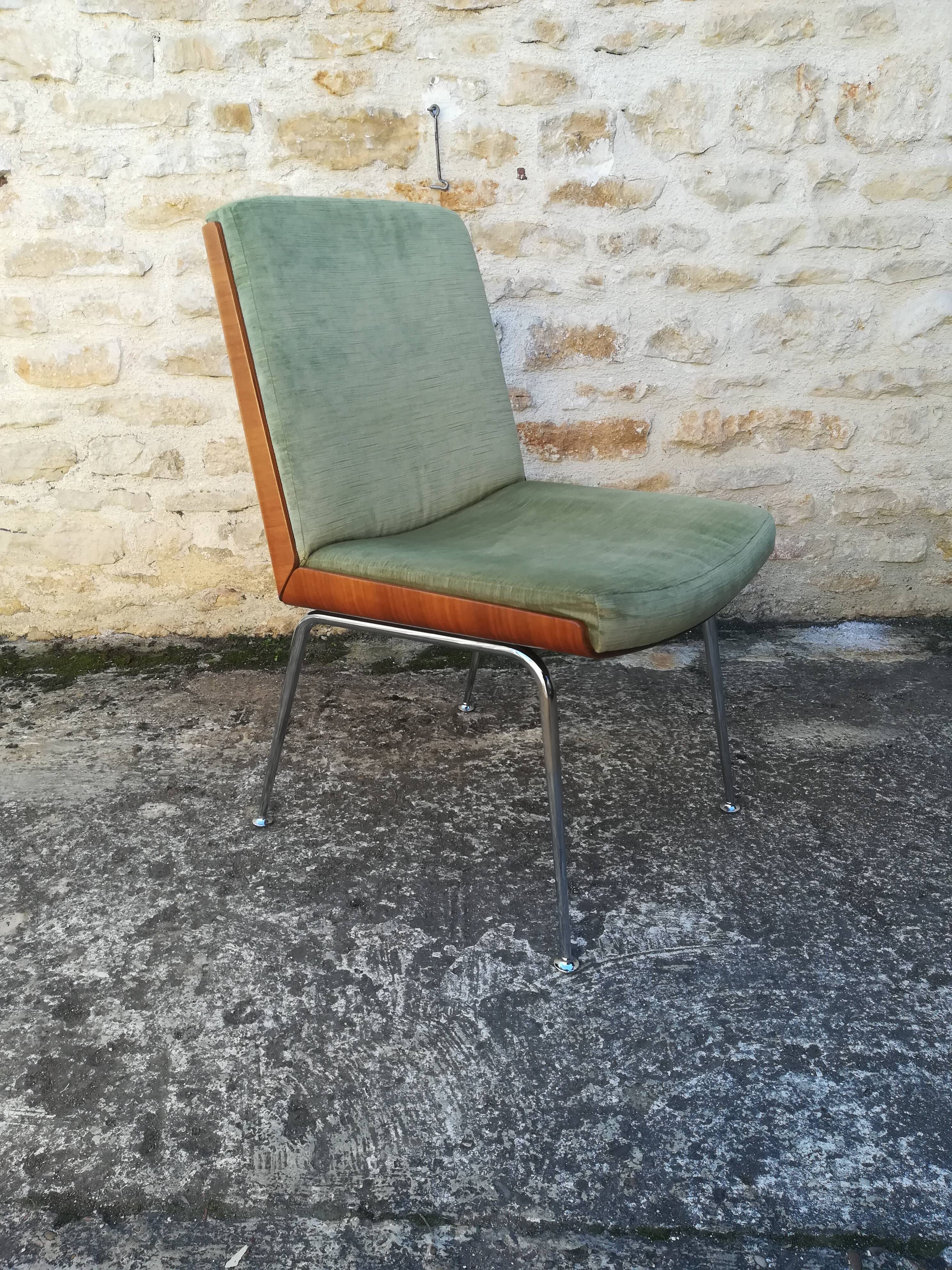 Shell chairs and green fabric