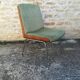 Shell chairs and green fabric