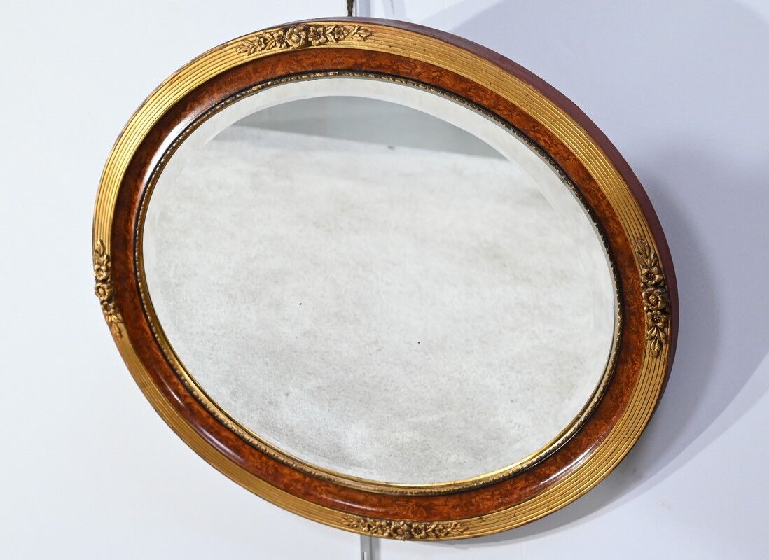 Oval mirror in gilded wood – early twentieth century
