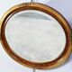 Miroir ovale en bois doré – début XXe