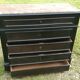 Blackened wooden chest of drawers with 5 drawers