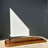 Trio of rounded rectangular trays or cups in monoxyl teak L:35