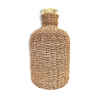 Glass bottle and braided rope