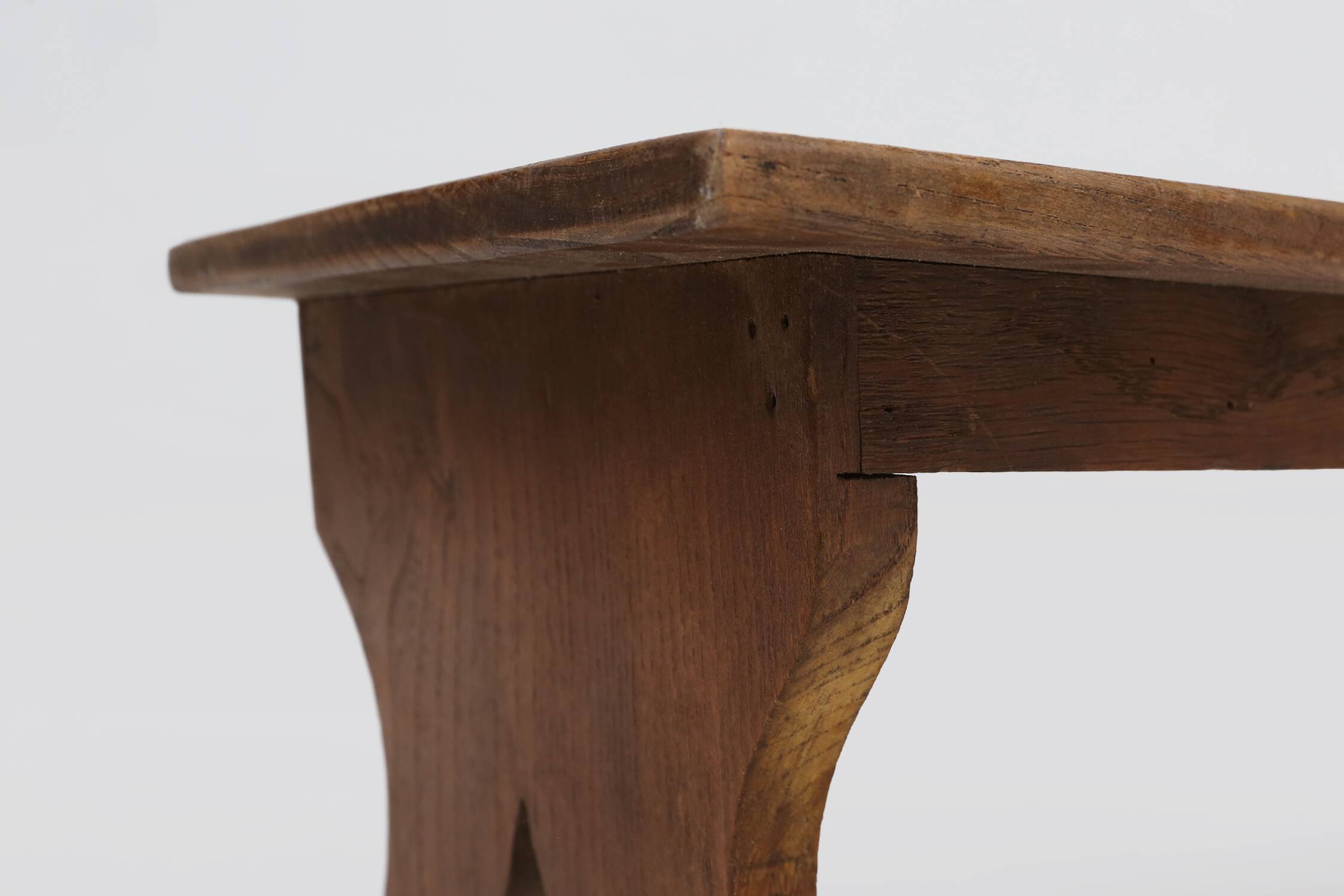 Small rustic wooden stool with curved base, France ca. 1900