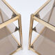 Pair of sofa tips in gilded metal and glass