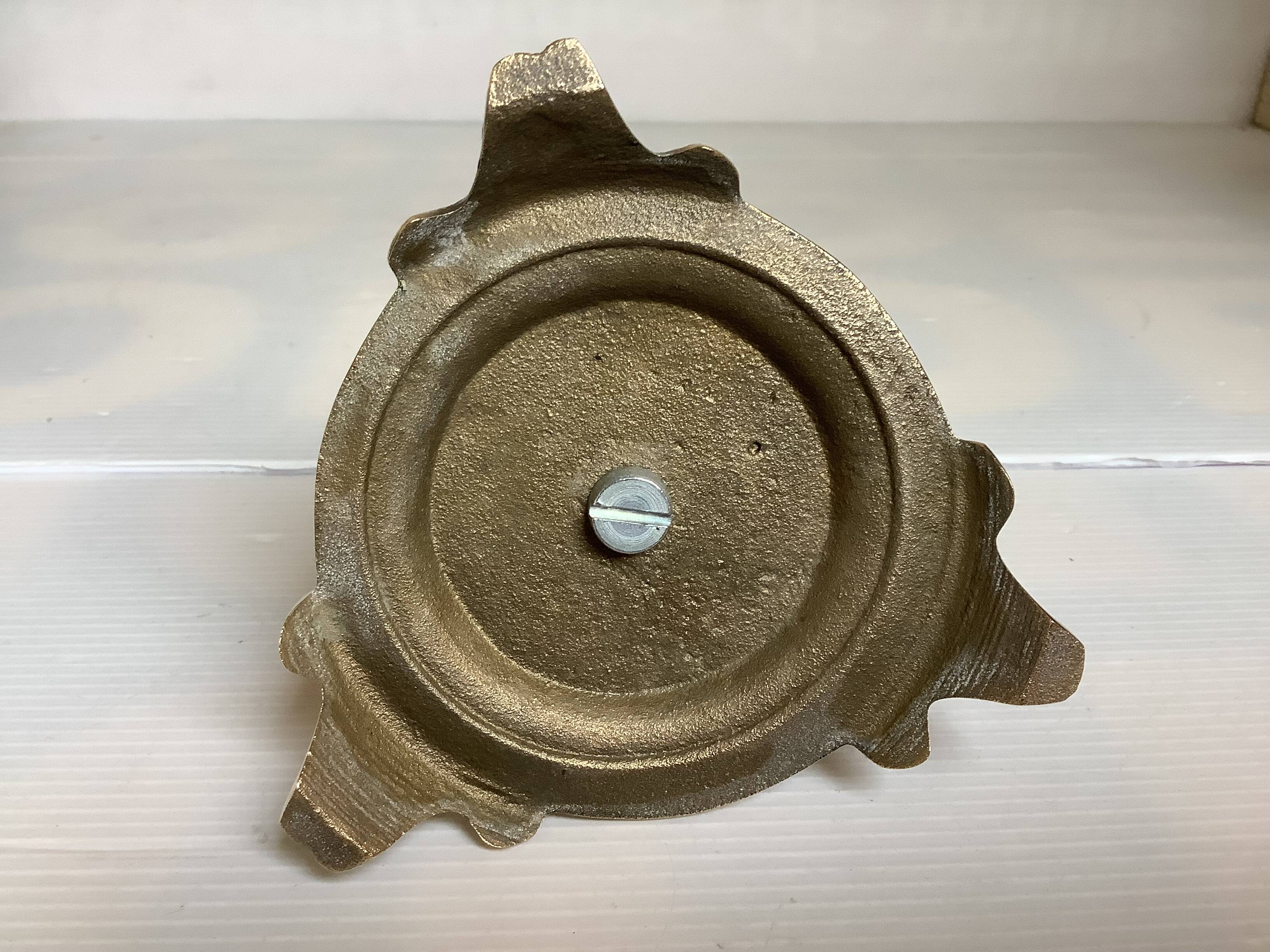 Tripod candlestick in worked bronze