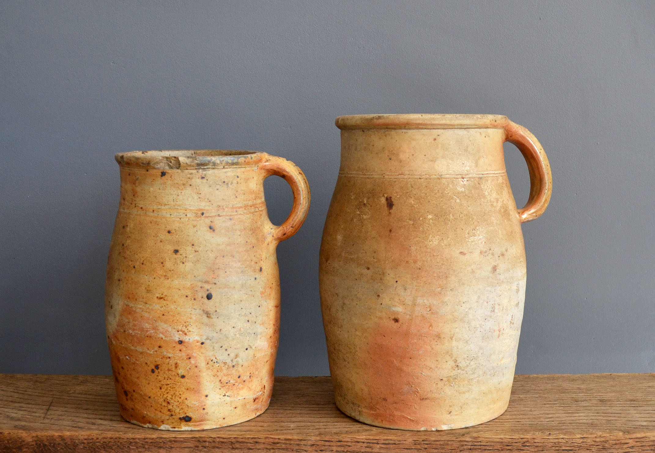 two jugs - old pots in matt sandstone