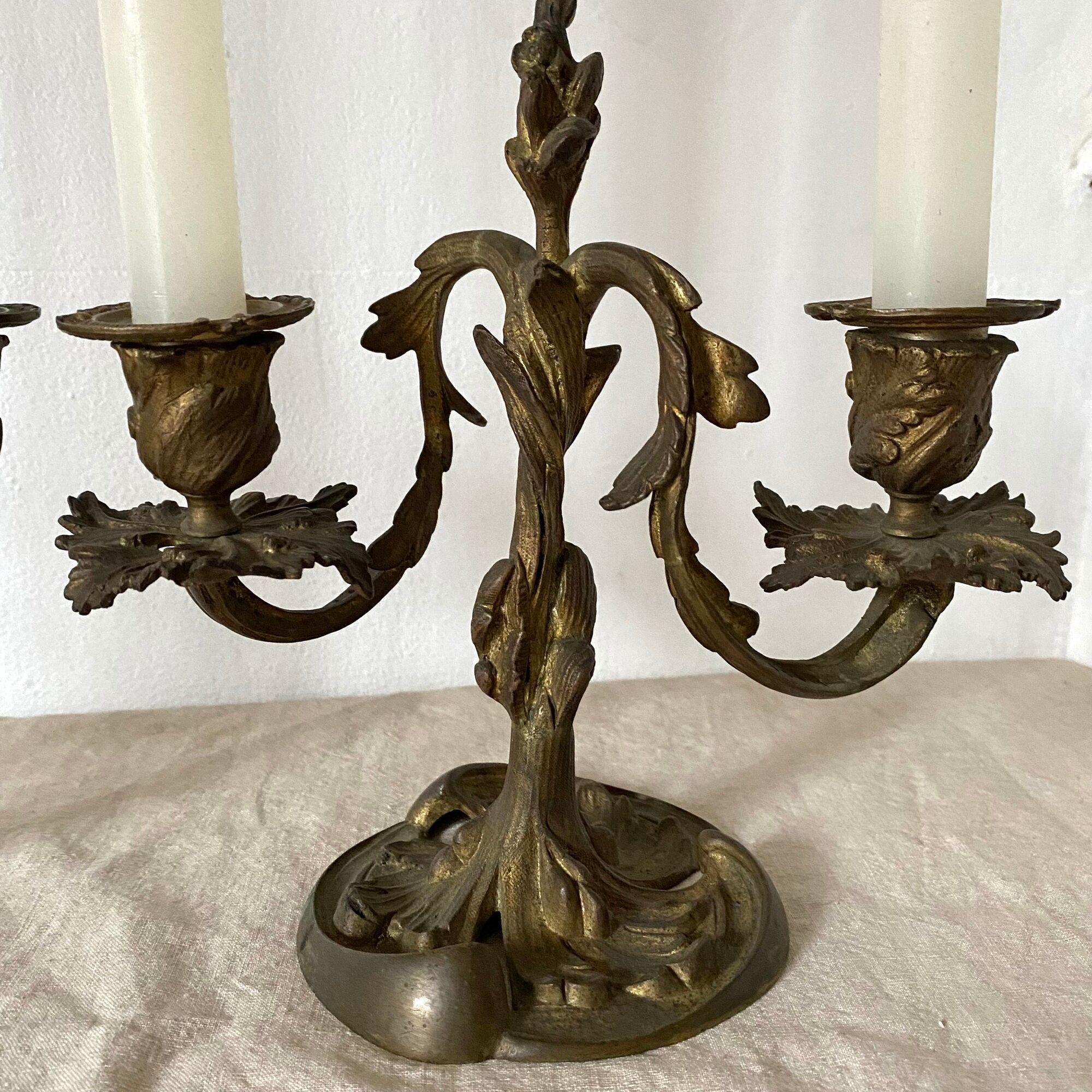 Pair of antique bronze candlesticks at the end of the table XIXth