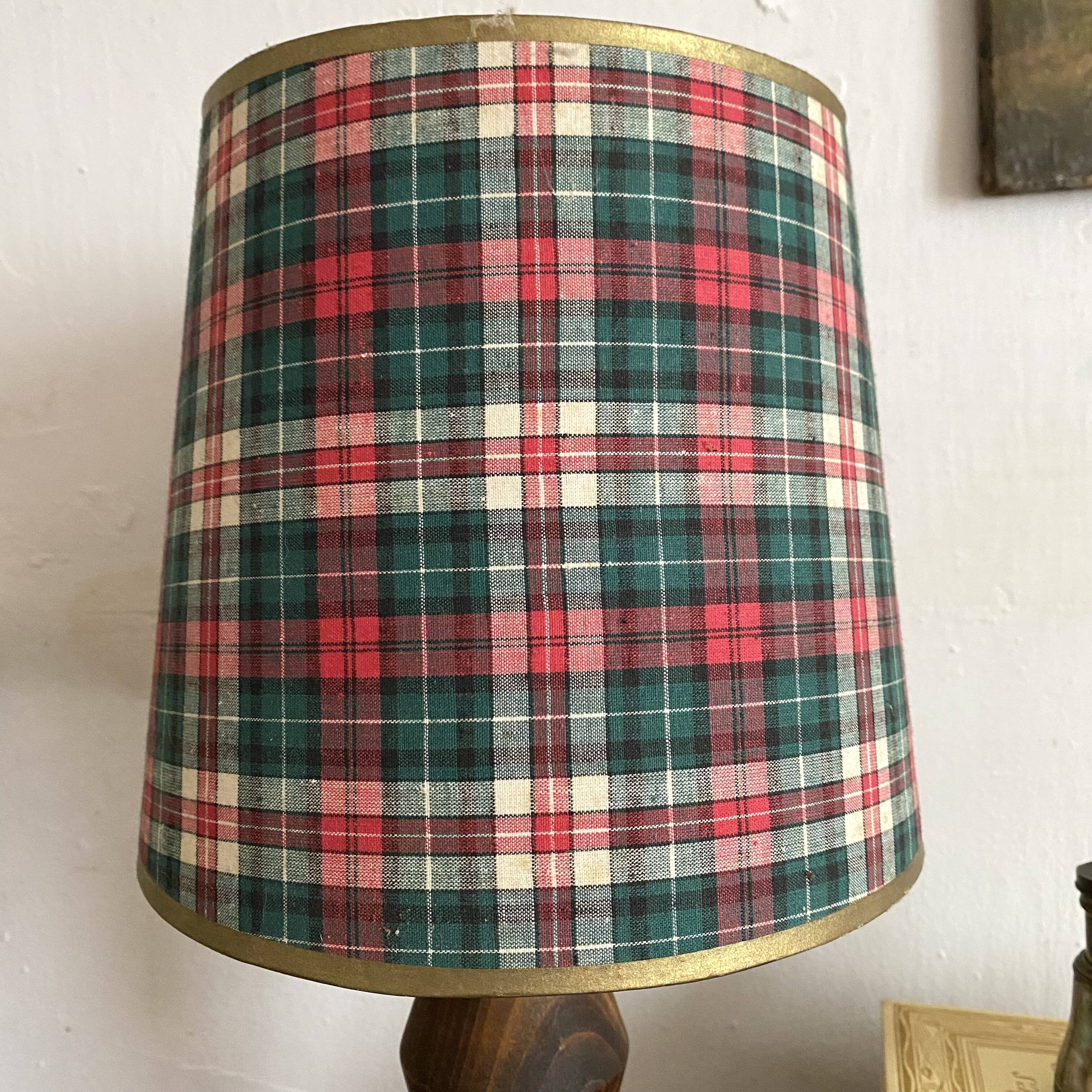 Turned wooden lamp, tartan lampshade.
