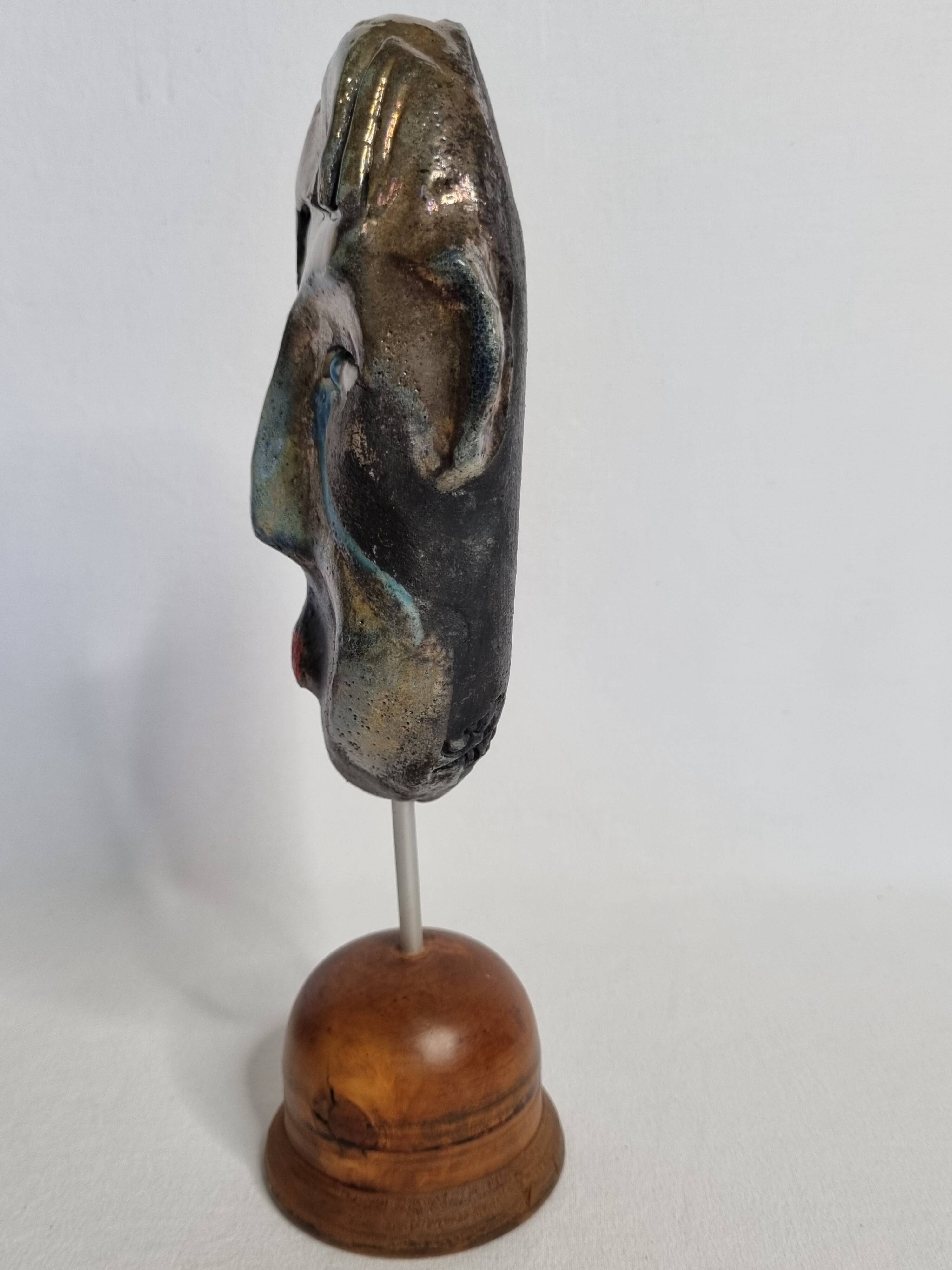 Signed raku ceramic mask on wooden base Contemporary sculpture 30 cm