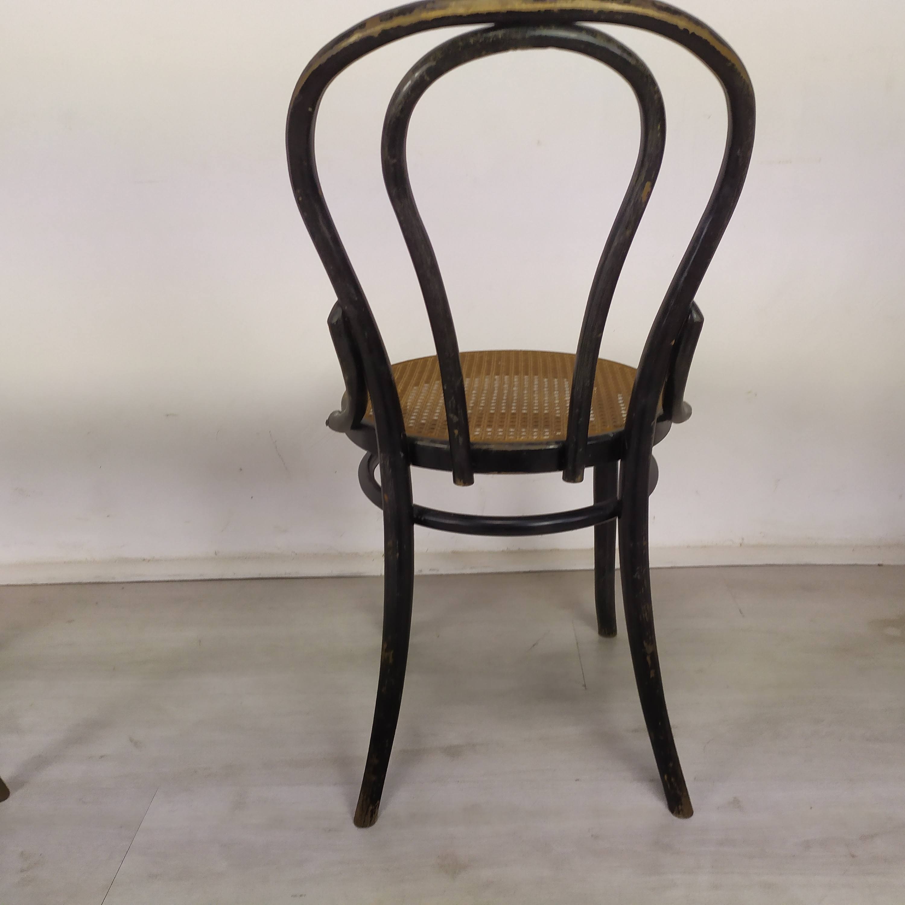 Black canned bistro chairs