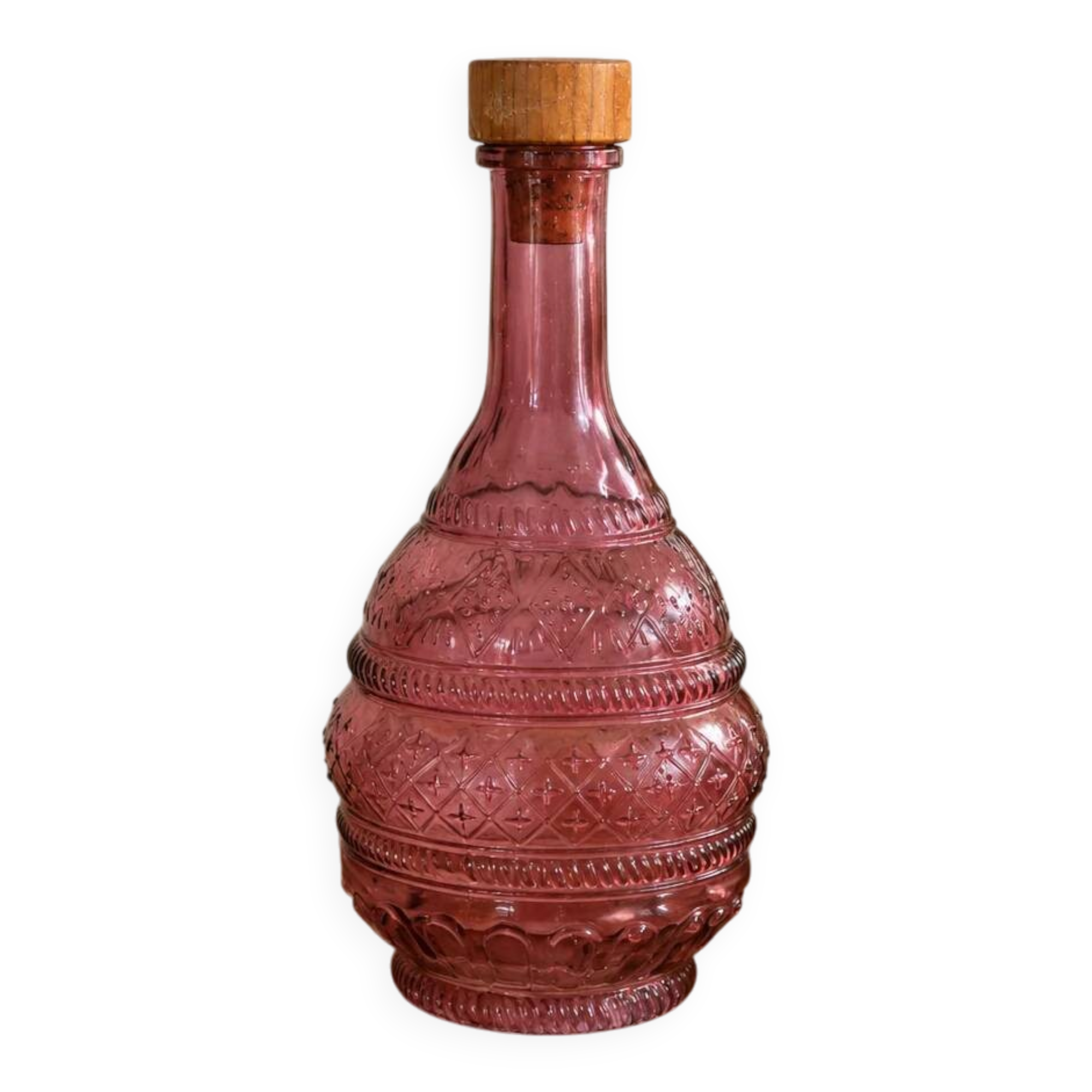 Vintage pink pressed glass carafe – retro decorative bottle with wooden stopper.