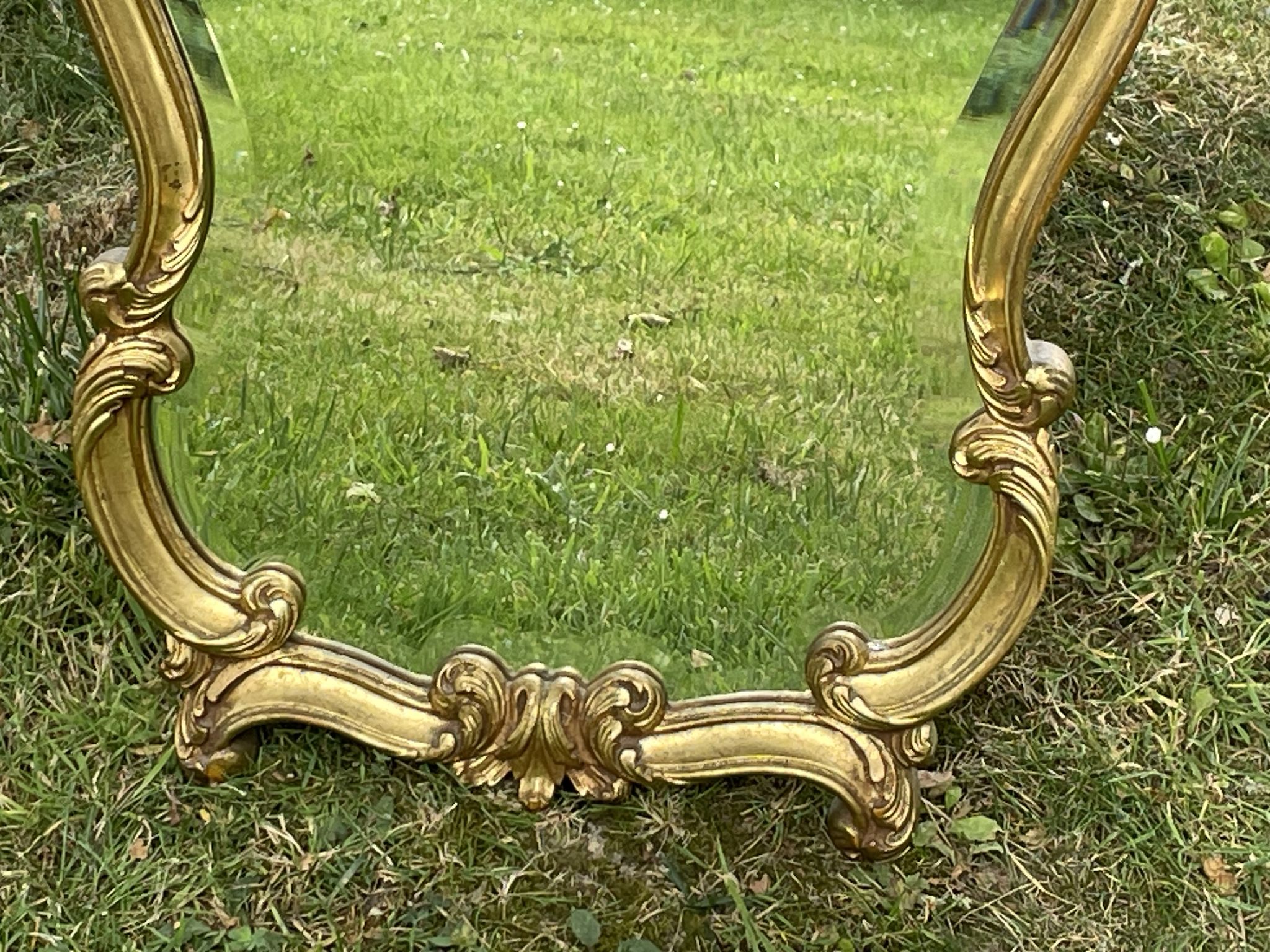Beveled gilded wood mirror with violin shapes, Louis XV baroque style shell