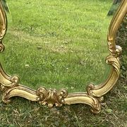 Beveled gilded wood mirror with violin shapes, Louis XV baroque style shell