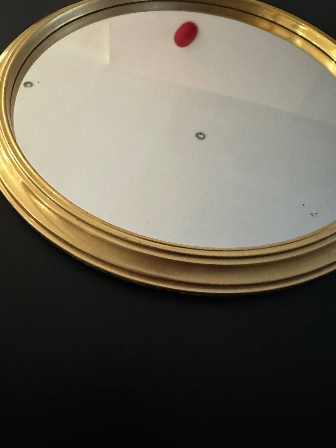 Round golden mirror