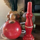 Large red wooden cup-and-ball game, 9 cm in diameter.