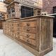 Large workshop furniture transformed into a TV unit.