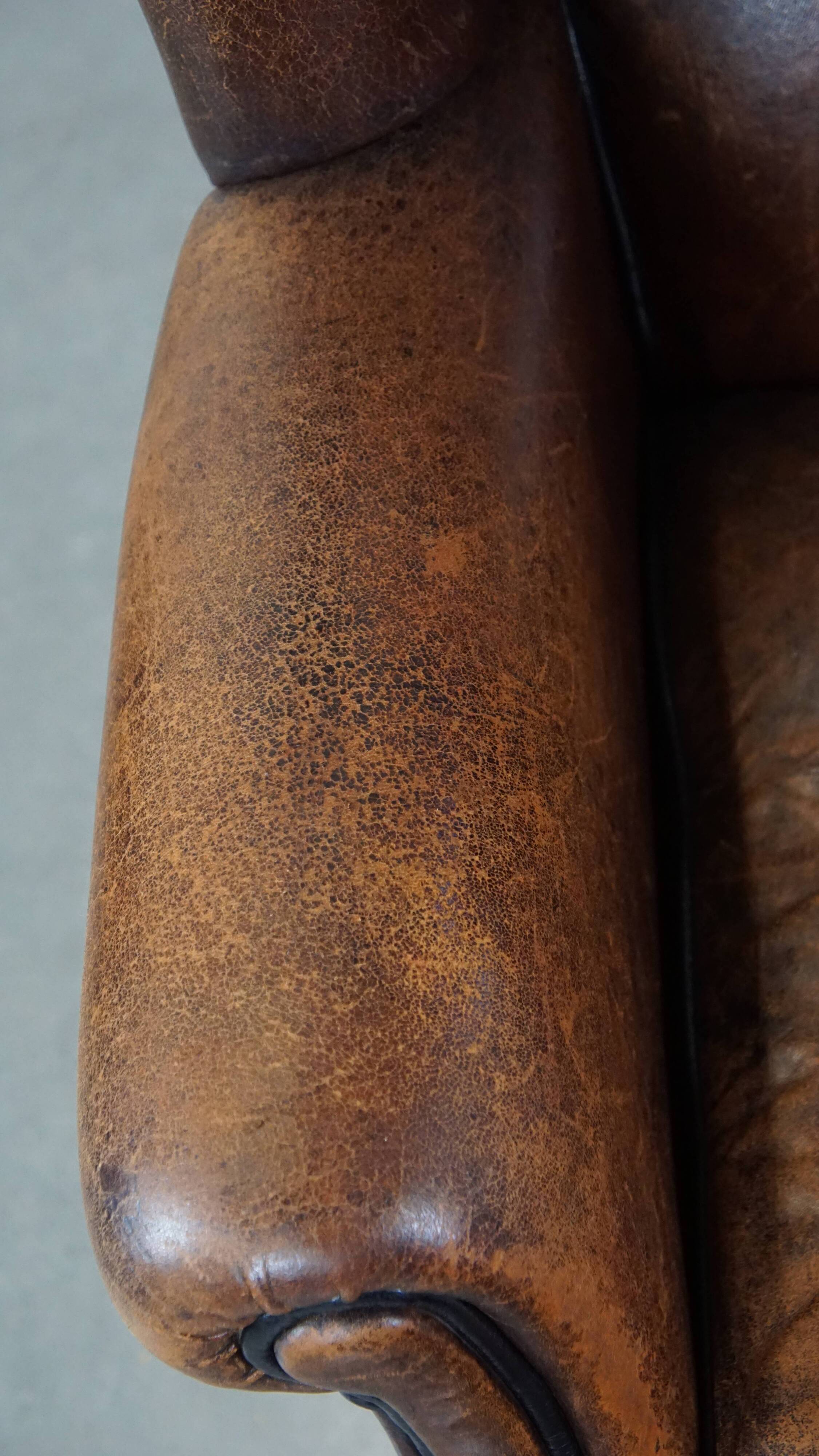 Sheep leather wing chair with patina