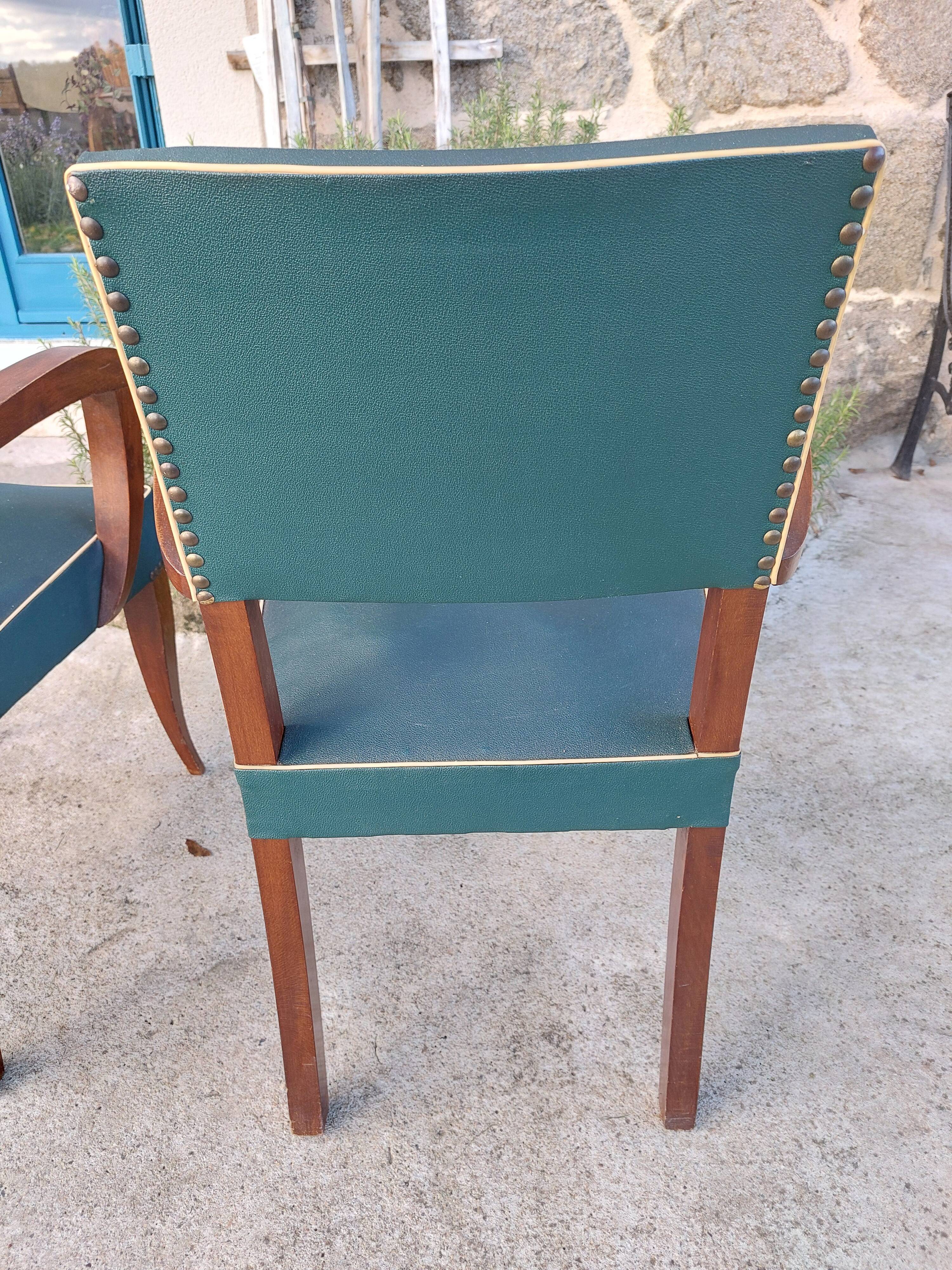 pair of dark green bridge armchairs