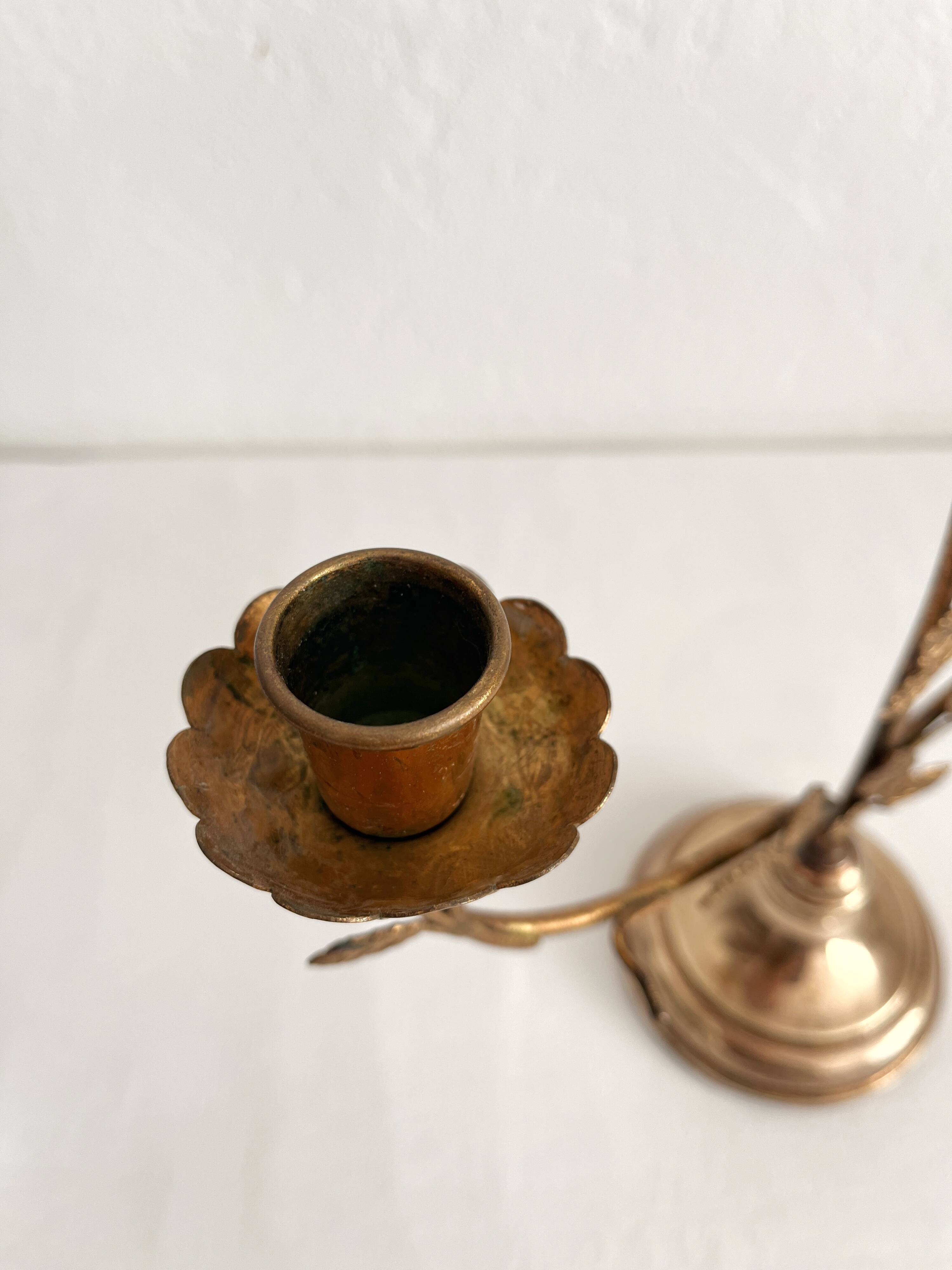 Antique bronze and brass candlestick with golden leaves