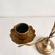 Antique bronze and brass candlestick with golden leaves