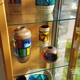 Mid-century pattern Vetrata vases and bowls by Aldo Londi for Bitossi Italy. Black, blue, orange and yellow on a brushed background.